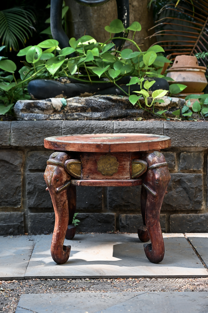 ELEPHANT MEDALLION - ROUND TEAK TABLE WITH BRASS REPOUSSÉ ELEPHANT FACES
