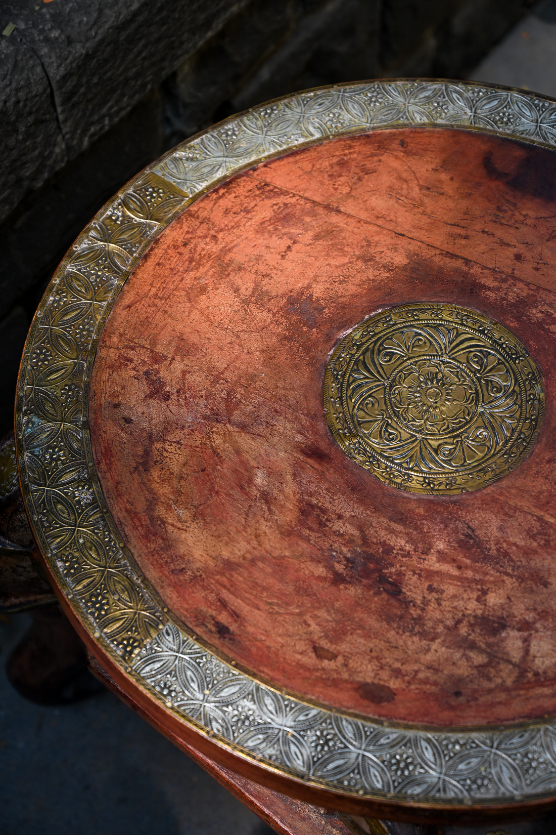 ELEPHANT MEDALLION - ROUND TEAK TABLE WITH BRASS REPOUSSÉ ELEPHANT FACES