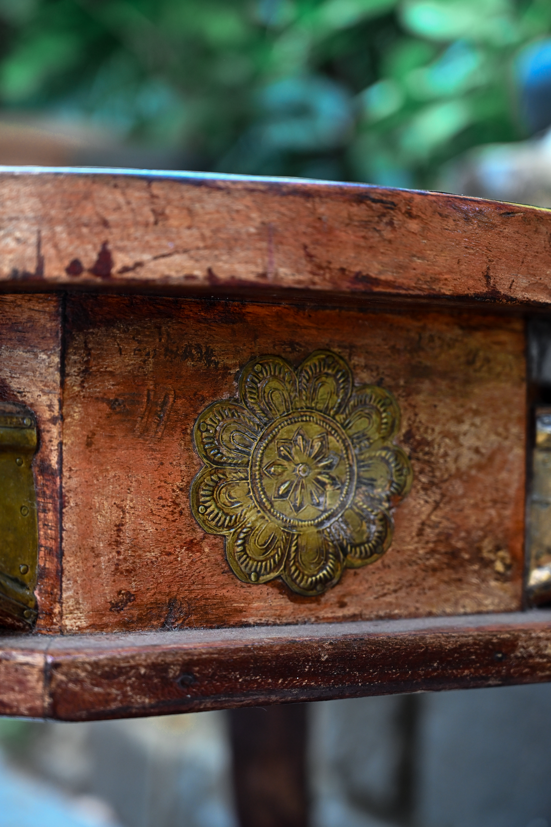 ELEPHANT MEDALLION - ROUND TEAK TABLE WITH BRASS REPOUSSÉ ELEPHANT FACES