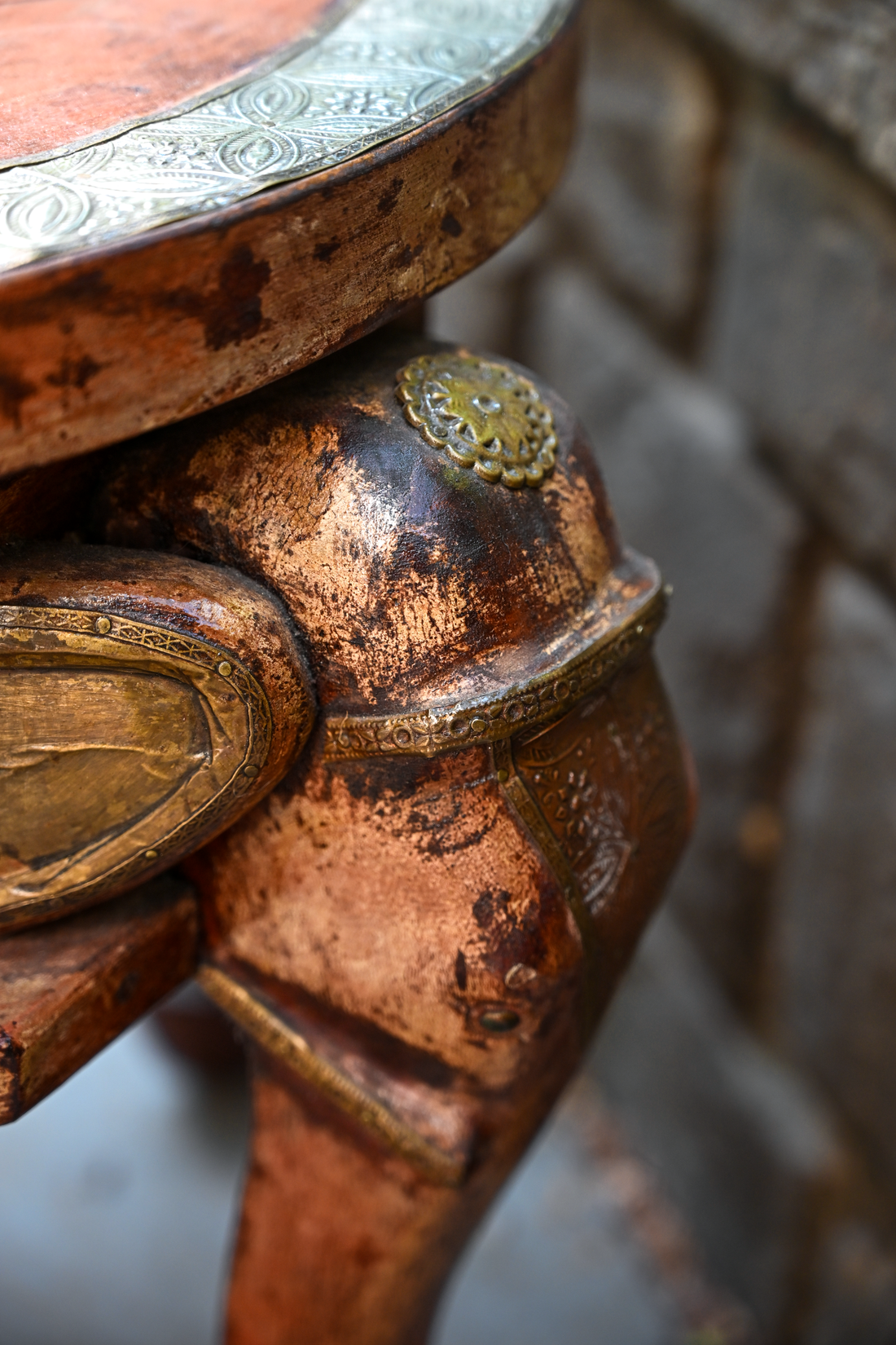 ELEPHANT MEDALLION - ROUND TEAK TABLE WITH BRASS REPOUSSÉ ELEPHANT FACES