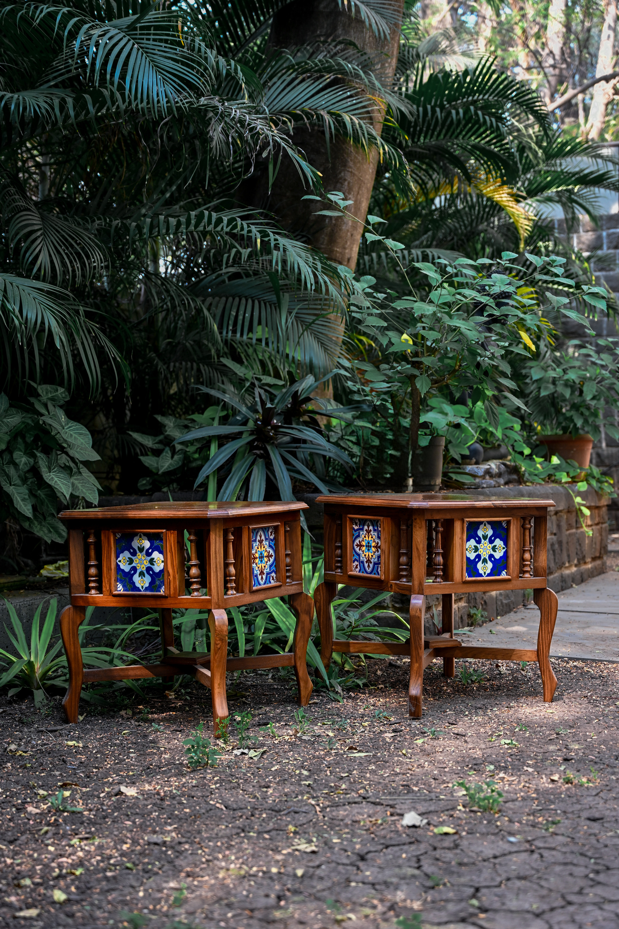 BOTANICAL SYMMETRY – PAIR OF TEAK SIDE TABLES WITH CERAMIC TILE INLAYS