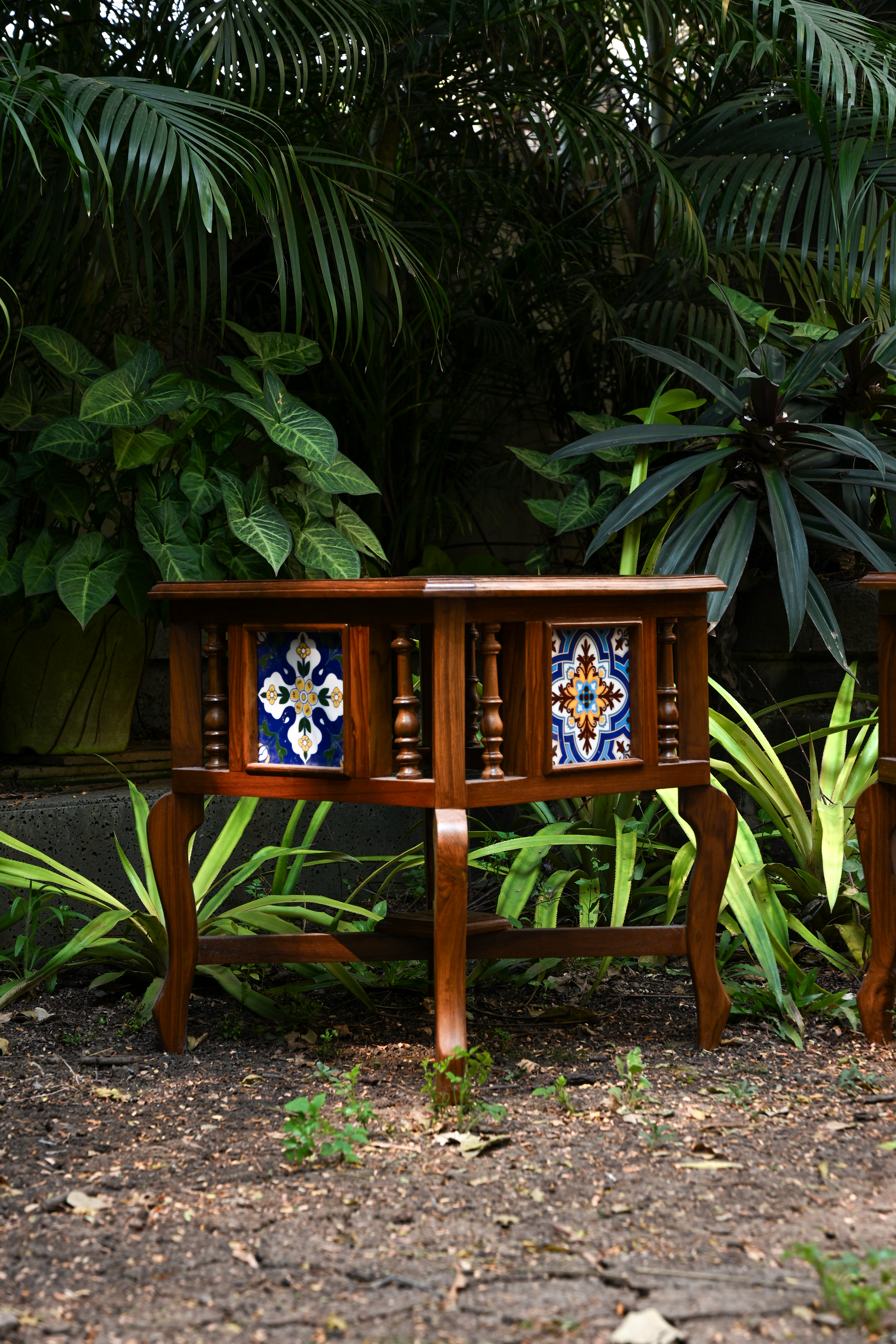 BOTANICAL SYMMETRY – PAIR OF TEAK SIDE TABLES WITH CERAMIC TILE INLAYS