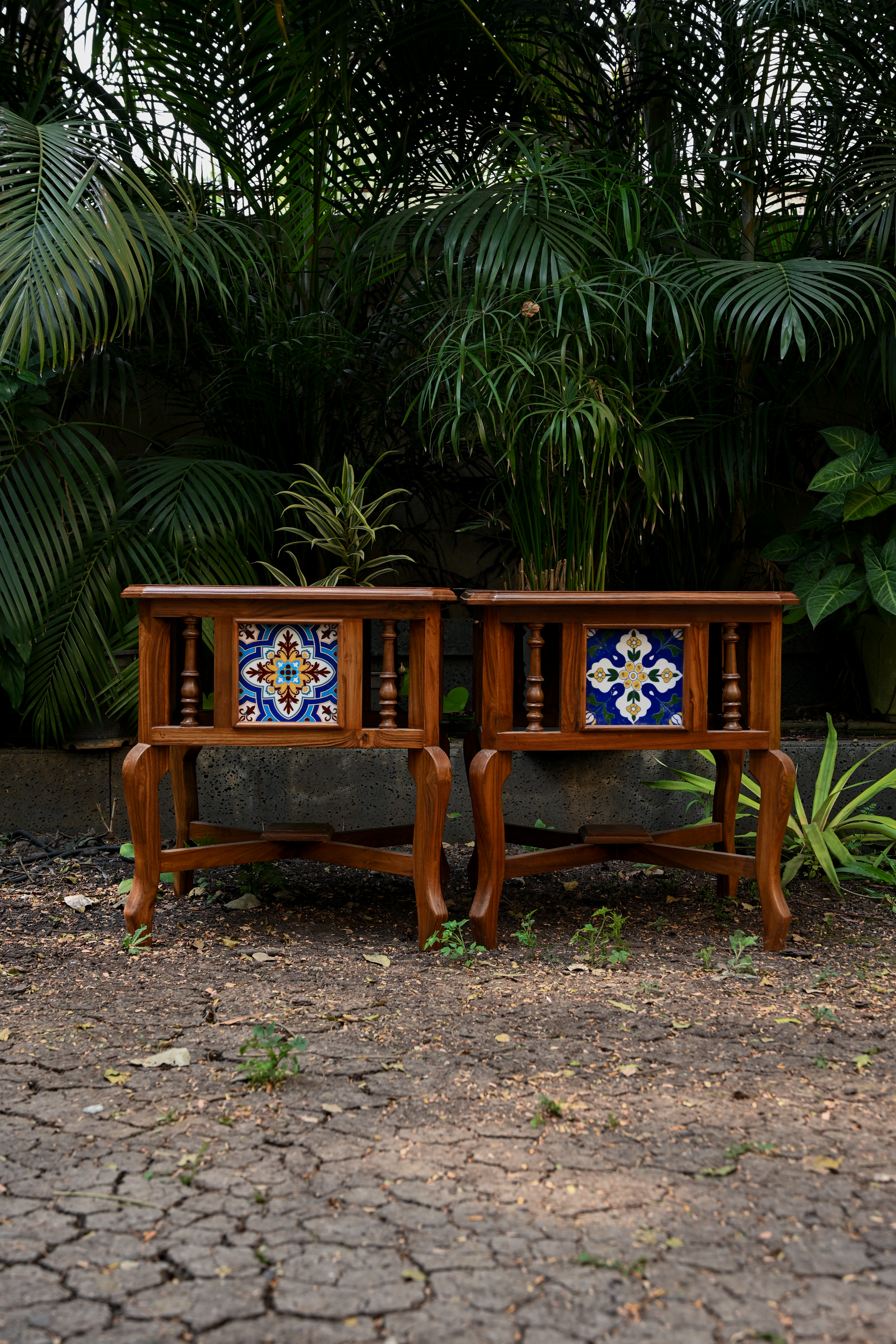 BOTANICAL SYMMETRY – PAIR OF TEAK SIDE TABLES WITH CERAMIC TILE INLAYS