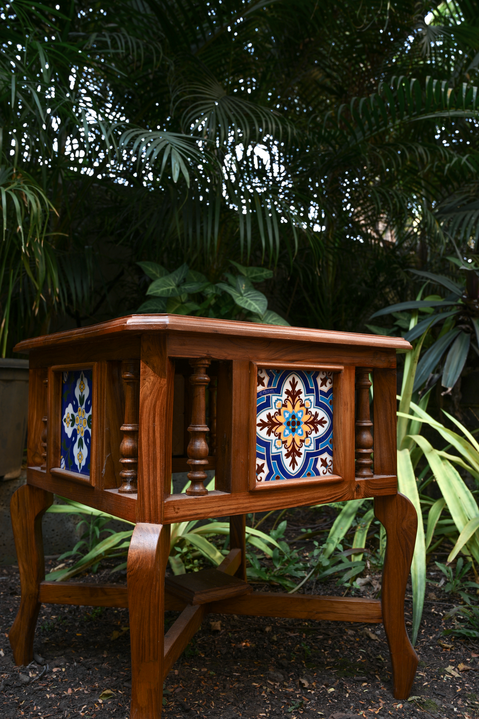 BOTANICAL SYMMETRY – PAIR OF TEAK SIDE TABLES WITH CERAMIC TILE INLAYS