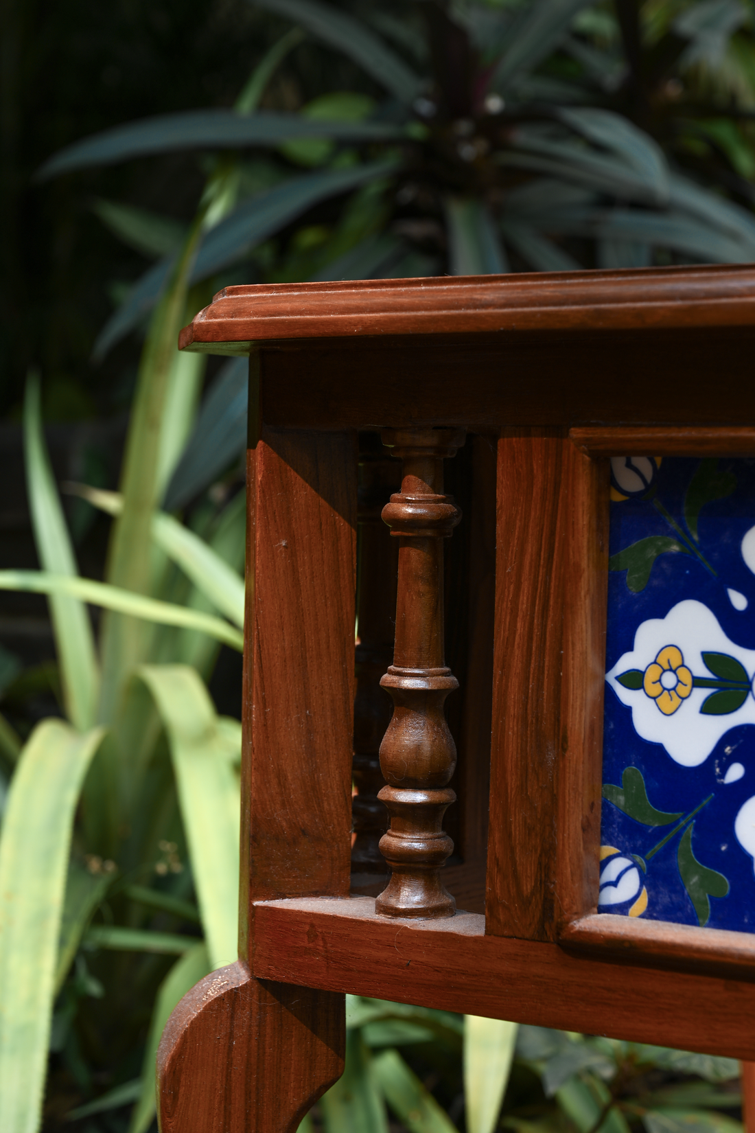 BOTANICAL SYMMETRY – PAIR OF TEAK SIDE TABLES WITH CERAMIC TILE INLAYS